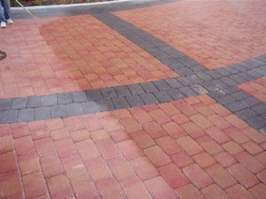 A paver installation at a new high end office building required durable protection to maintain the image of the property